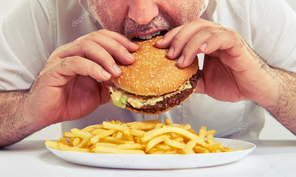 depositphotos_73149589-stock-photo-man-eating-burger-and-french